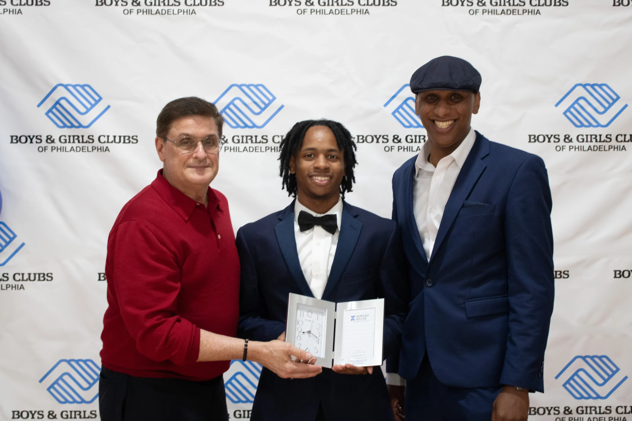 Three men at Boys & Girls Club event.